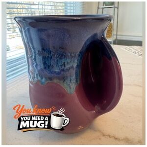 Clay in Motion, hand warmer mug designed for right handed use.  Signed and dated